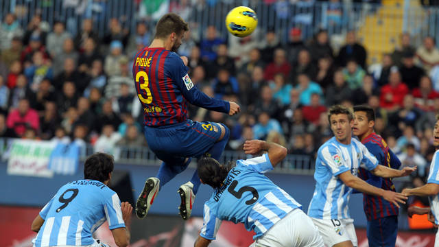Piqué playing against Màlaga / PHOTO: MIGUEL RUIZ-FCB